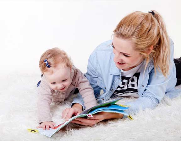 mother-reading-to-baby