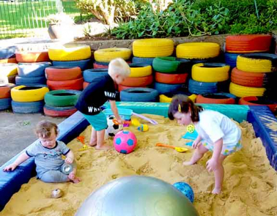 having-a-ball-with-friends-in-the-sandpit